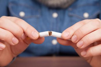 A man quitting cigarettes. Learn more about quitting tobacco.