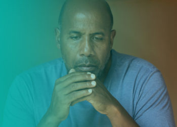 Man looking concerned. Learn more about quitting smoking.