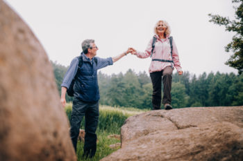A couple walks hand in hand in the mountains. Learn more about vaping and tobacco use in Colorado.