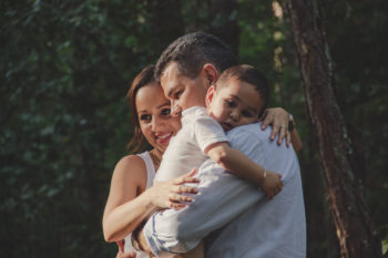 Parents and their toddler sun cuddle and smile. Learn more about vaping and tobacco use in Colorado.