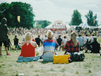 view of people sitting at an outdoor concert